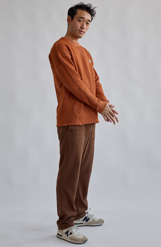 TWOTHIRDS Dundrum sweater umber orange from recycled polyester among other materials for men | Sophie Stone