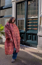 Rainkiss Moiré regenjas rood van gerecycled PET uniseks | Sophie Stone
