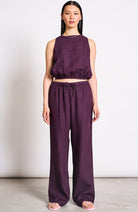 JAN–JUNE Fun cherry-colored lacquered linen pants for women | Sophie Stone 